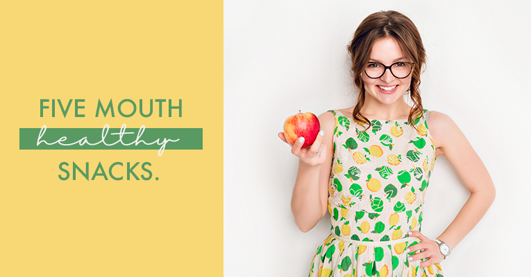 woman with apple and smiling