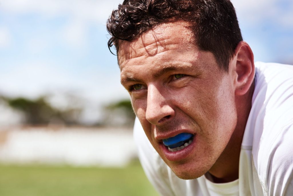athletic man with mouthguard